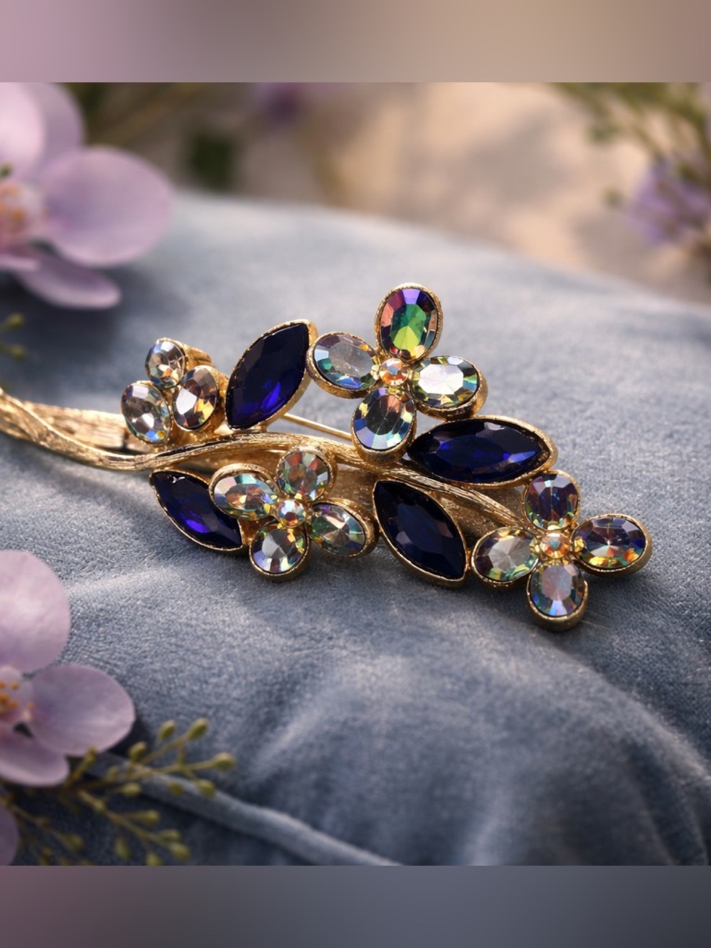 Vintage Gold Floral Brooch with Deep Blue and Iridescent Stones